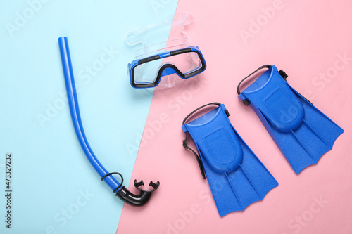 Bilde på lerret Children's Snorkel, diving mask and fins on blue pink pastel background
