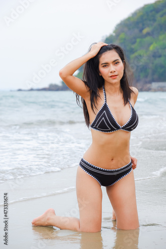 sexy asia woman wearing bikini on the beach