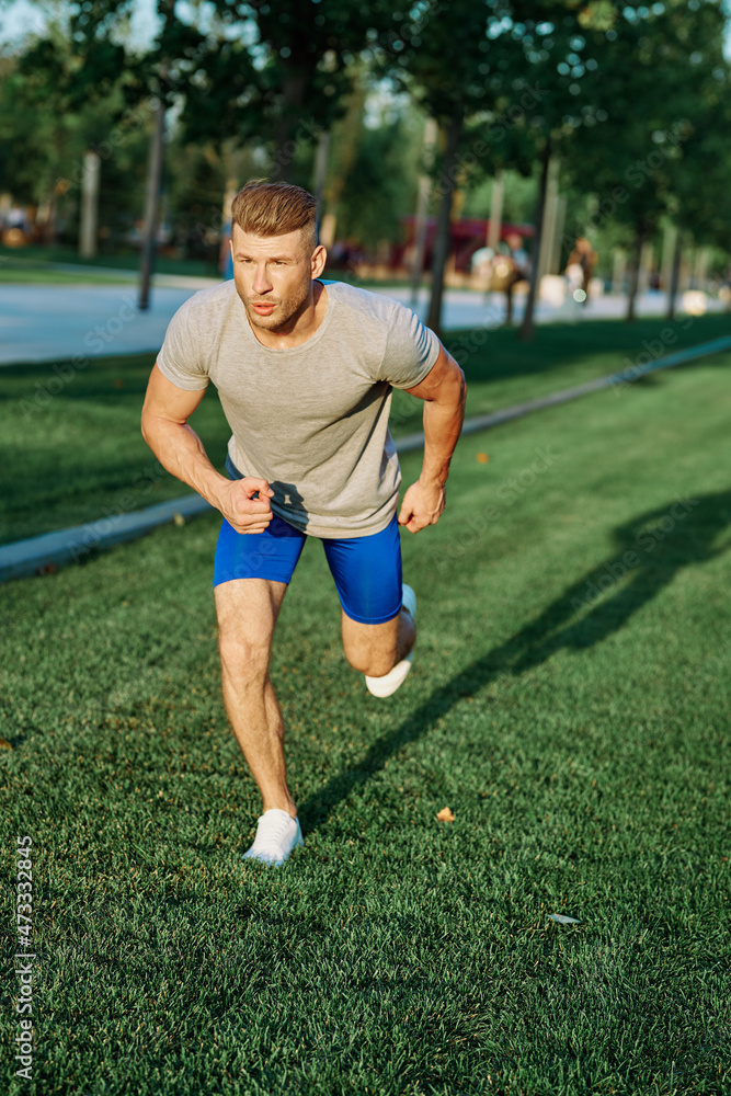 athletic man in the park workout jogging exercise summer