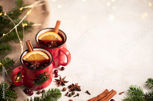 Mulled wine in red cups on the Christmas table
