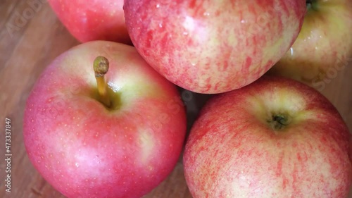 Apples of varieties Gala and Ligol, video close-up. Fruits rotate.
 photo