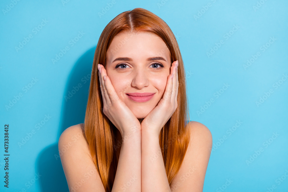 Obraz premium Photo portrait red haired woman wearing casual outfit smiling palms near face isolated pastel blue color background