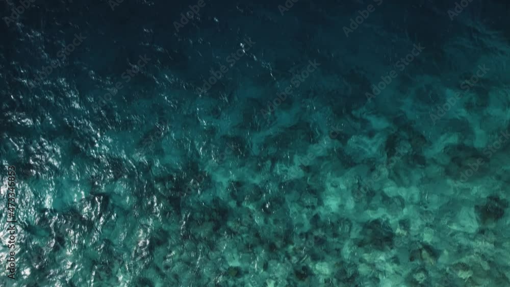 Drone view fly over beautiful turquoise ocean in tropical islands. Aerial shot of light waters and calm waves and coral reef underwater. Concept of tourism Drone view fly over beautiful turquoise ocean in tropical islands. Aerial shot of light waters and calm waves and coral reef underwater. Concept of tourism