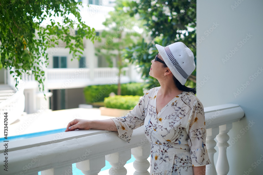 portrait senior asia woman wear a hat in garden portrait senior asia woman wear a hat in garden