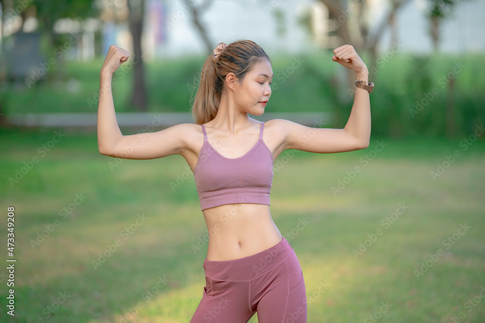 Asian beautiful slim woman at the park,Young girl love healthy exercise,Teen wear sportswear Asian beautiful slim woman at the park,Young girl love healthy exercise,Teen wear sportswear