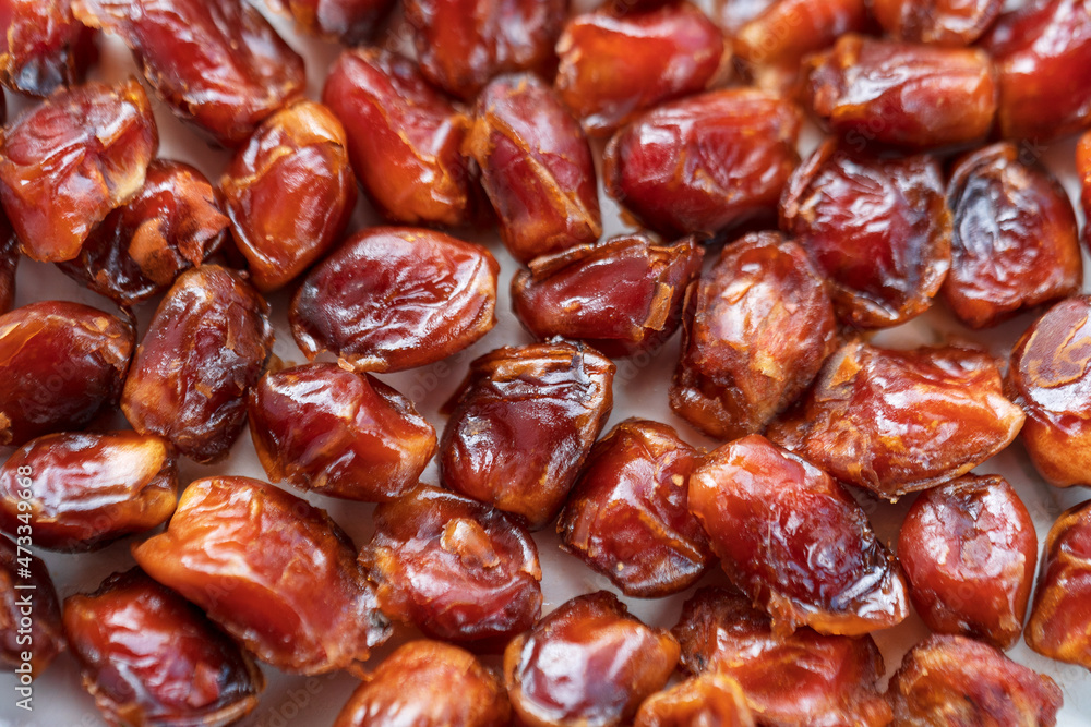 High Fiber Date Fruits. Top view of dried dates displayed on a spice