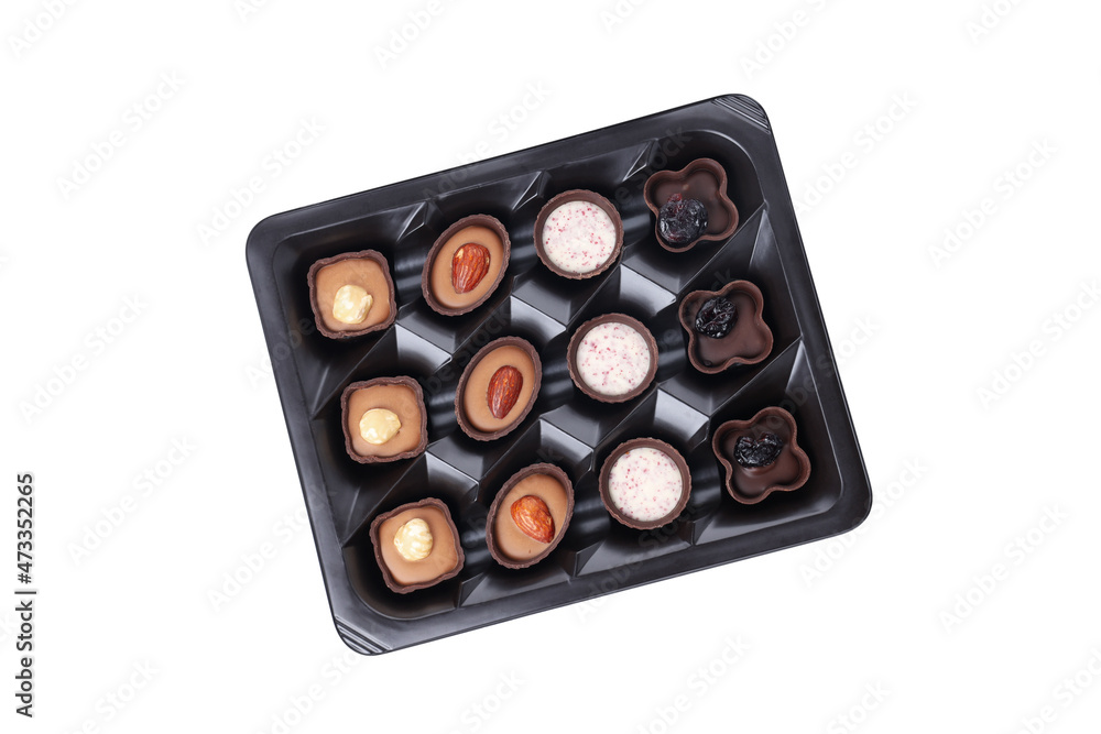 Chocolate candies in box isolated on white background