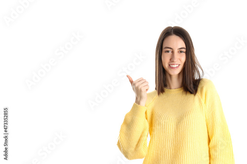 Attractive girl in yellow sweater isolated on white background