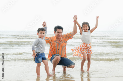 asia family have fun together on the beach, travel the sea thailand