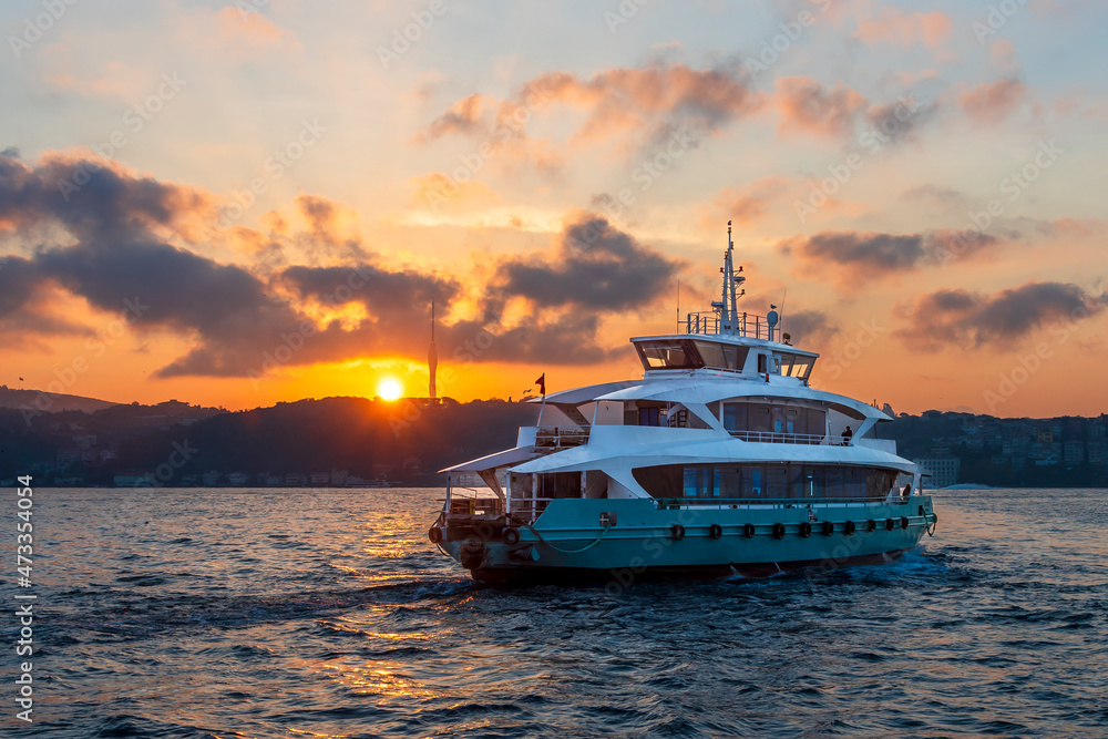Ferry is on The Bosphorus at sunrise in Istanbul Ferry is on The Bosphorus at sunrise in Istanbul