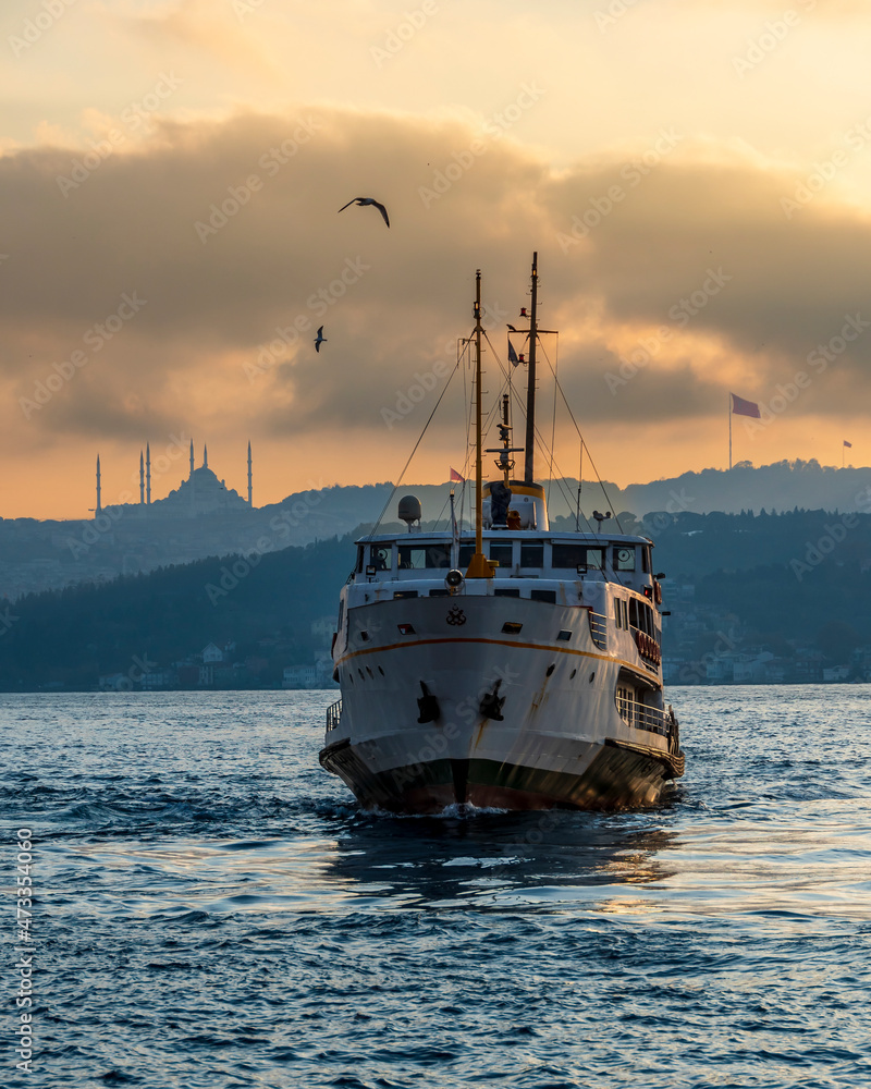 Ferry is on The Bosphorus at sunrise in Istanbul