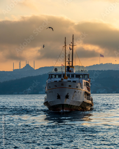 Ferry is on The Bosphorus at sunrise in Istanbul