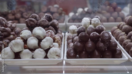 Choosing chocolate in a row, shop in Dubai