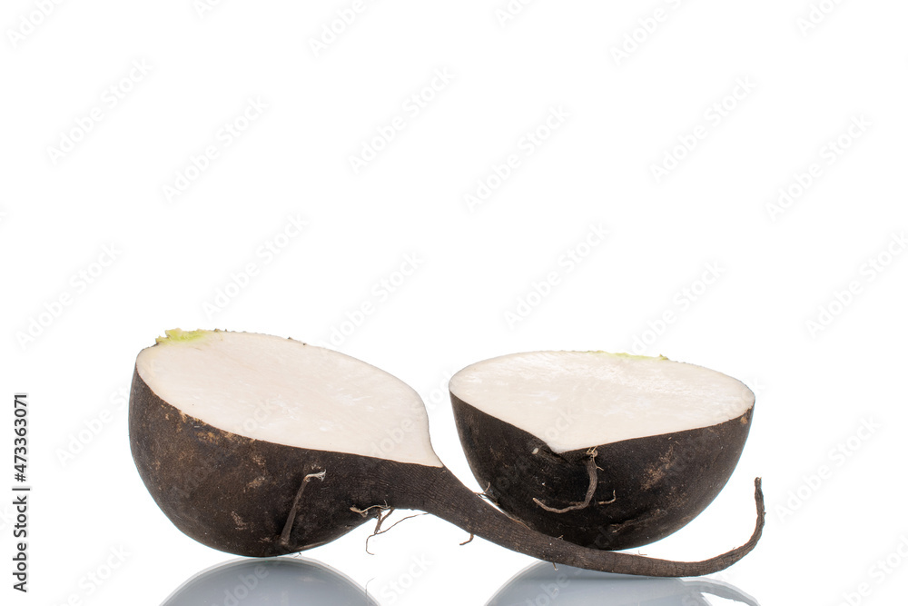 Two halves of ripe juicy black radish, close-up, isolated on white. Two halves of ripe juicy black radish, close-up, isolated on white.