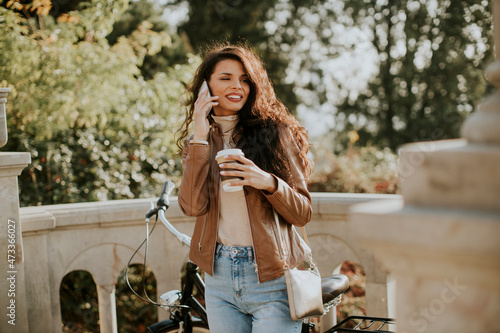 Young woman with mobile pho...