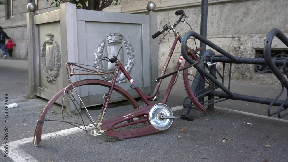 Europe, Italy , MIlan December 2021 - bike tied to the road completely destroyed by vandalism and theft of thieves Europe, Italy , MIlan December 2021 - bike tied to the road completely destroyed by vandalism and theft of thieves