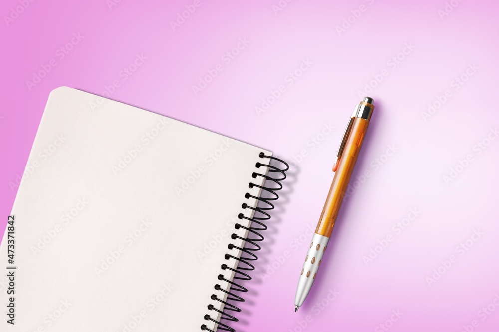 Office pen and notebook on background is equipment for using drawing and writing notes in. Office pen and notebook on background is equipment for using drawing and writing notes in.