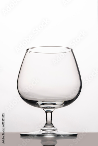 glasses for cognac on a white background. silhouette of glass goblet for alcohol
