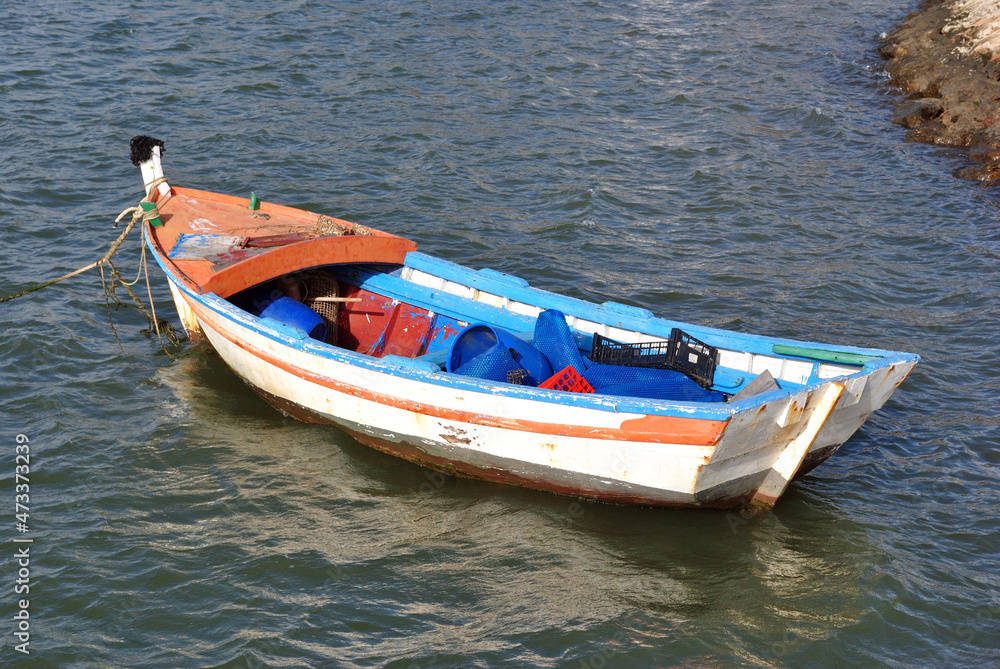 Wooden Fishing Boat Floating on Choppy Water 