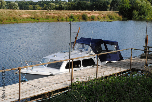 Old River Motor Cruiser Moored beside Derelict Jetty 