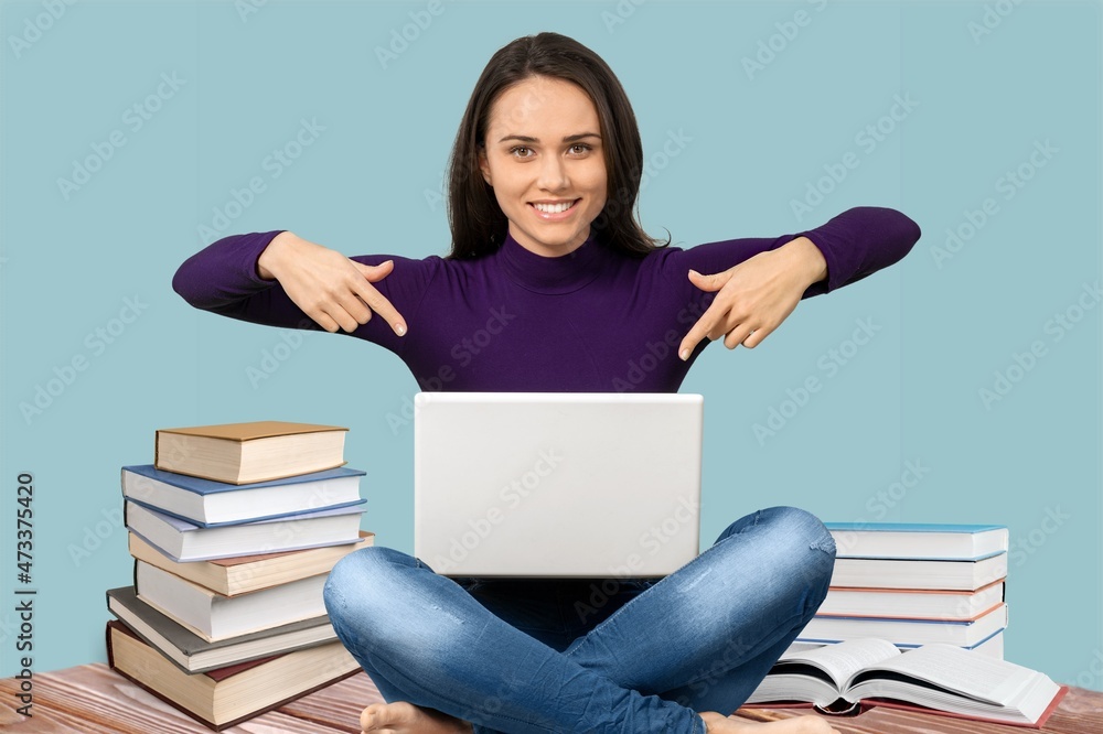 Happy smiling young girl with a laptop computer Happy smiling young girl with a laptop computer