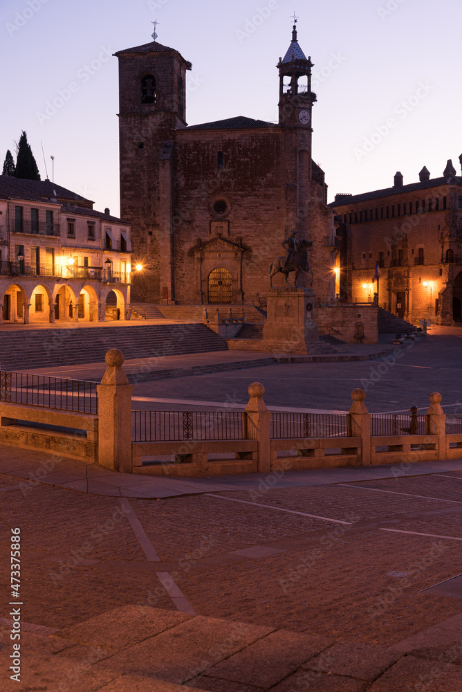 City landscape of the medieval old town of Trujillo with the Church of San Martin in Gothic and Renaissance style and the equestrian statue of Francisco Pizarro at sunrise, Caceres, Extremadura, Spain