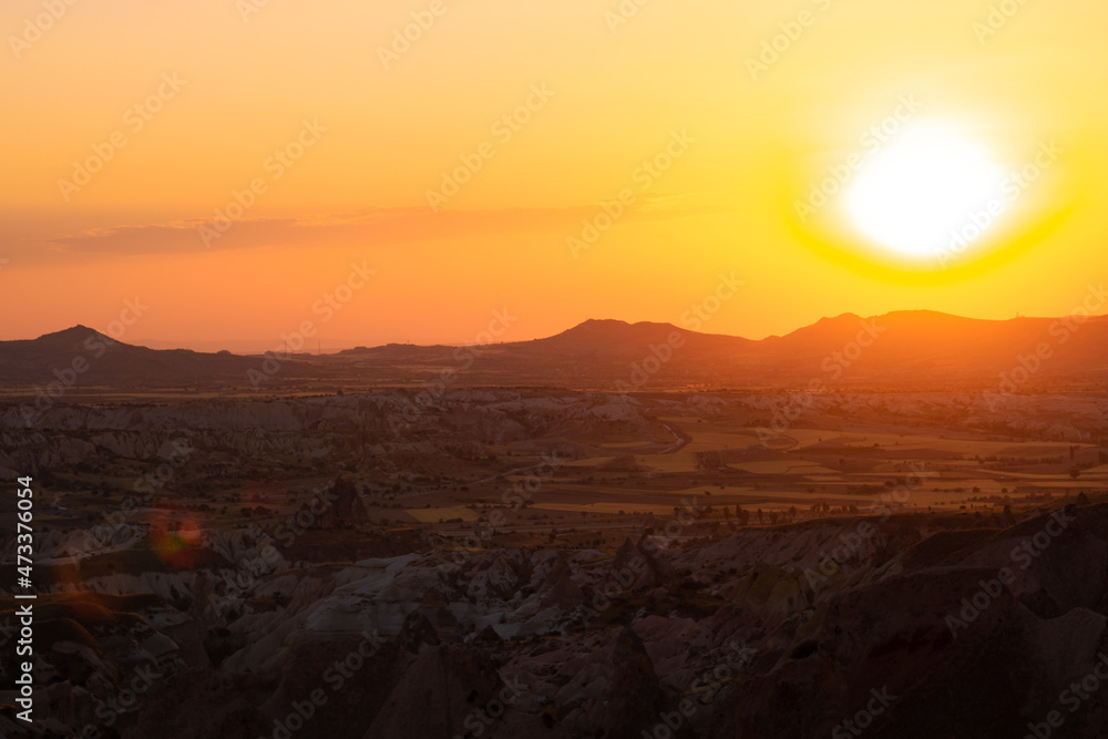 Sunset over the mountains. Sunset scene with silhouettes of mountains