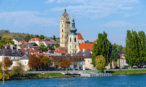 Shipping pier at Krems on the river Danube with the towers of the parish church Saint Nicholas and the former Frauenberg church, Austria photo