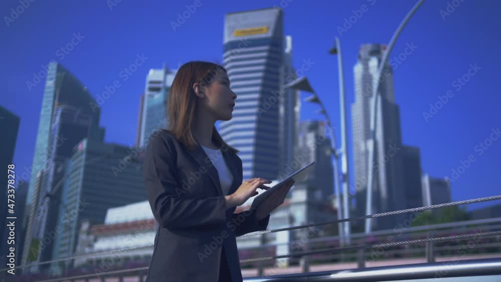 Future is now. Woman using virtual reality device while traveling in Singapore . Future is now. Woman using virtual reality device while traveling in Singapore .
