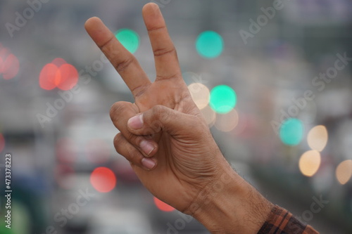 Victory image using hand in beautiful background