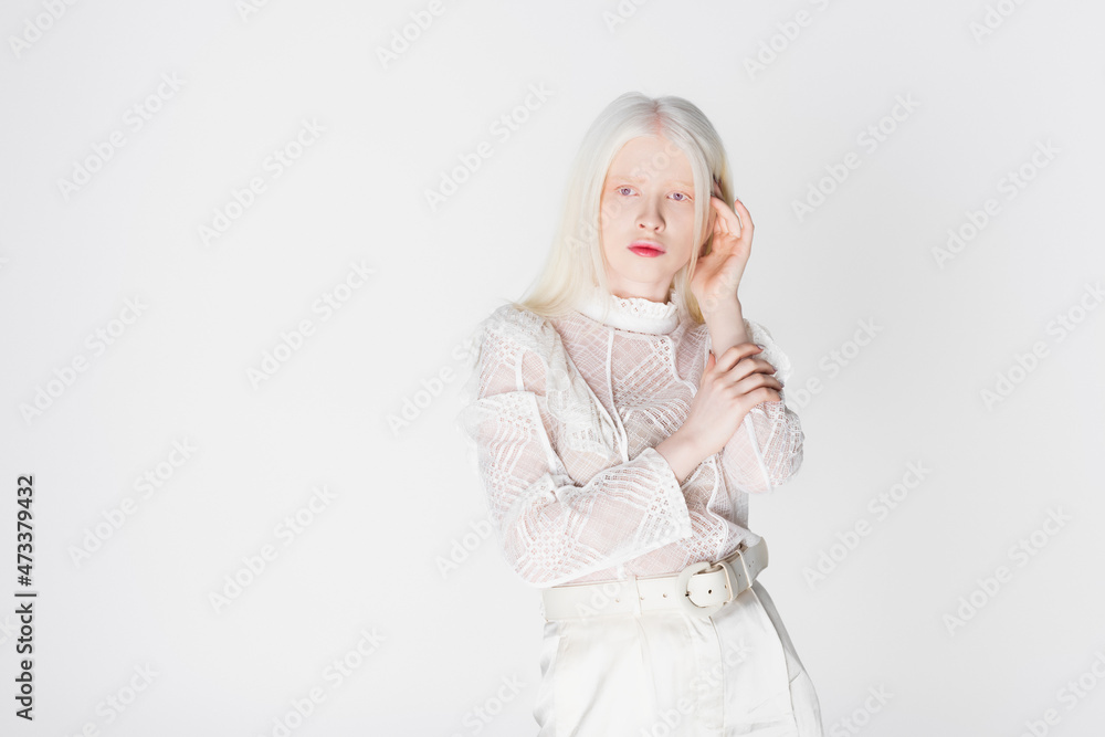 Pretty albino woman looking at camera isolated on white. Pretty albino woman looking at camera isolated on white.