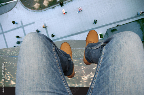 Картината върху платно Suicidal attempt by jumping from the roof of a tall building in the city, in the