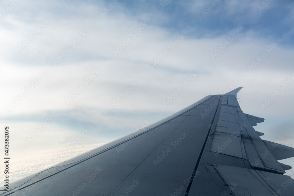 beautiful view of the plane wing and blue clouds