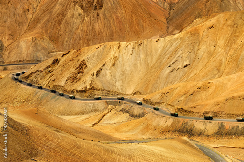 Aerial view of Zigzag road - famously known as jilabi road at old route of Leh Srinagar Highway, trucks passing, Ladakh, Jammu and Kashmir, India photo