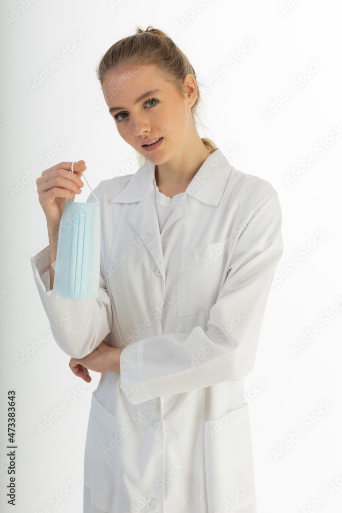 Covid19, coronavirus, healthcare and doctors concept. Portrait of optimistic russian female doctor assure everything be okay, wear medical mask to prevent catching virus, white coat. Covid19, coronavirus, healthcare and doctors concept. Portrait of optimistic russian female doctor assure everything be okay, wear medical mask to prevent catching virus, white coat.