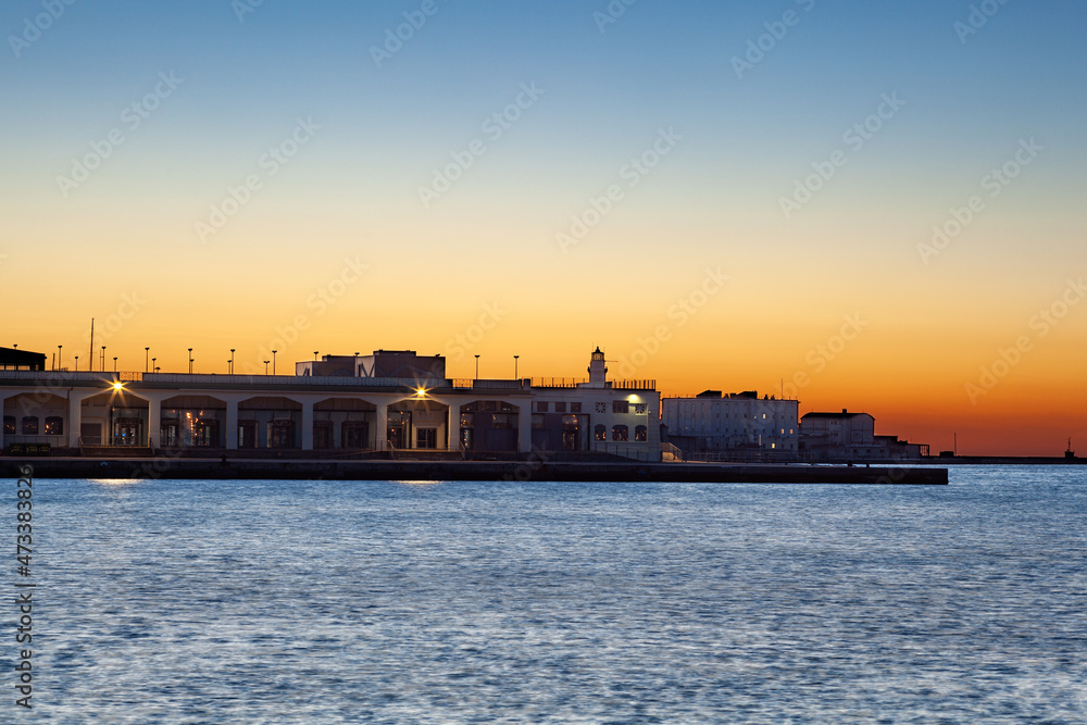 Trieste pier at sunset, Italy