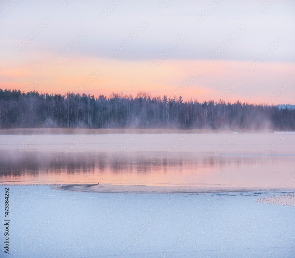 Winter landscape, the water of the lake under the snow soars against the background of dawn and the forest. Winter landscape, the water of the lake under the snow soars against the background of dawn and the forest.