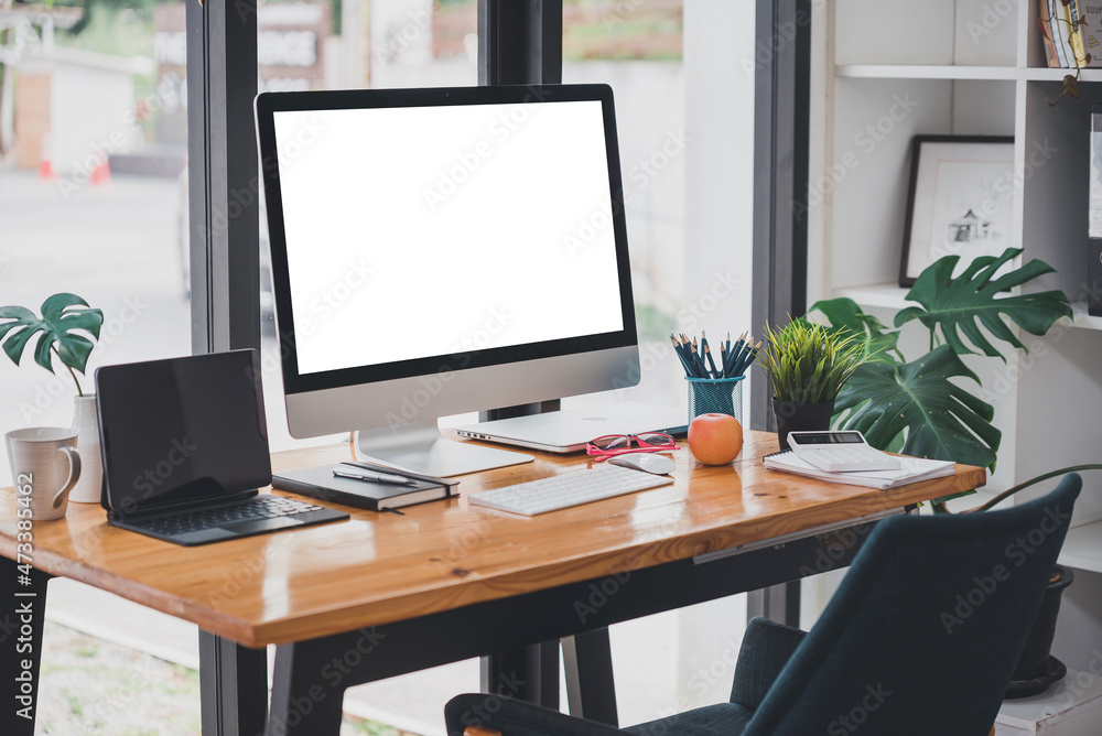 modern office with blank screen tablet and office equipment on the table modern office with blank screen tablet and office equipment on the table