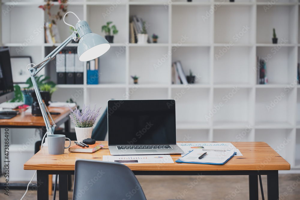 modern office with blank screen tablet and office equipment on the table modern office with blank screen tablet and office equipment on the table