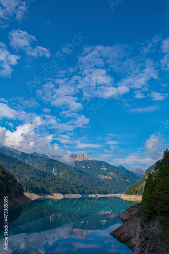 Low water in Sauris Lake, Lago di Sauris, in late September. The lake is artificial, formed by a dam, and is located in Udine Province, Friuli-Venezia Giulia, north east Italy 