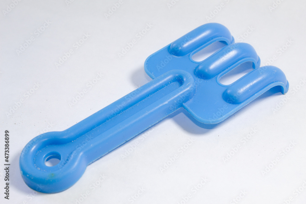 Toy rastel made of blue plastic Toy rastel made of blue plastic
