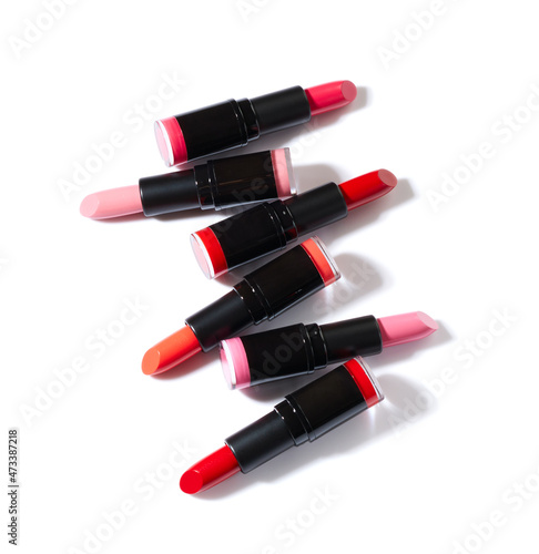 Lipsticks different colors isolated on white background