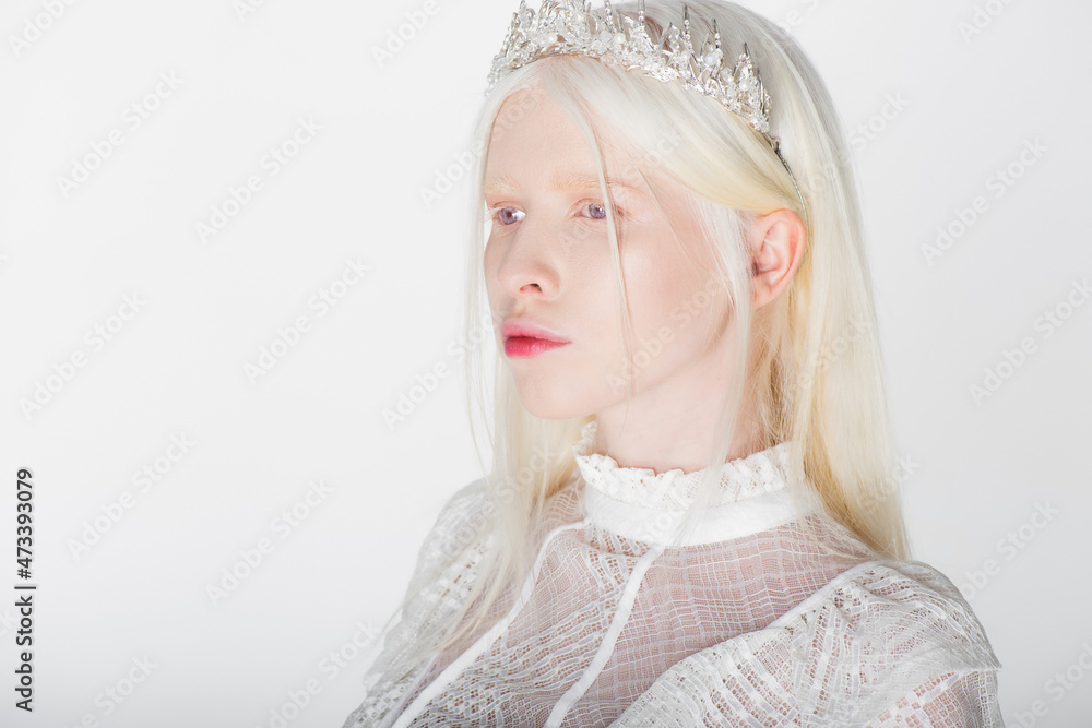 Pretty albino woman in crown with pearls and gems isolated on white. Pretty albino woman in crown with pearls and gems isolated on white.