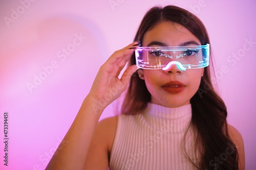 Asian woman with future digital glasses,future technology concept.