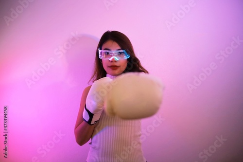 Woman in gloves boxing.
