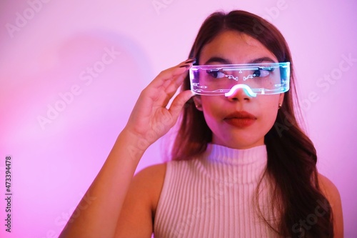 Asian woman with future digital glasses,future technology concept.