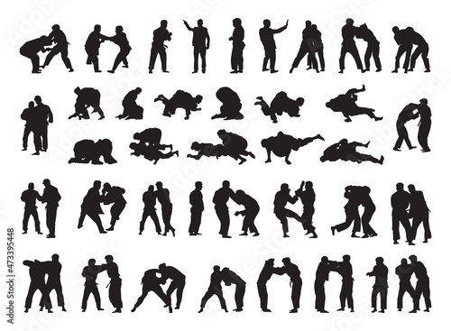 Collection of black silhouettes of people practicing judo. Shadows of the fighting men on a white background. Martial arts illustrations. photo