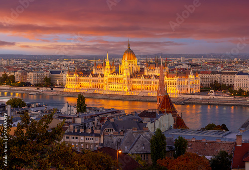 Illuminated Hungarian Parliament building at sunset in Budapest, Hungary