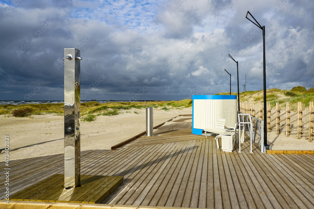 new modern beach infrastructure with a changing room, shower, led lights and wooden floors