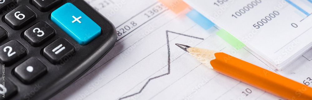 Accounting document with pencil and checking financial chart. Concept of banking, financial report and financial audit. Accounting document with pencil and checking financial chart. Concept of banking, financial report and financial audit.